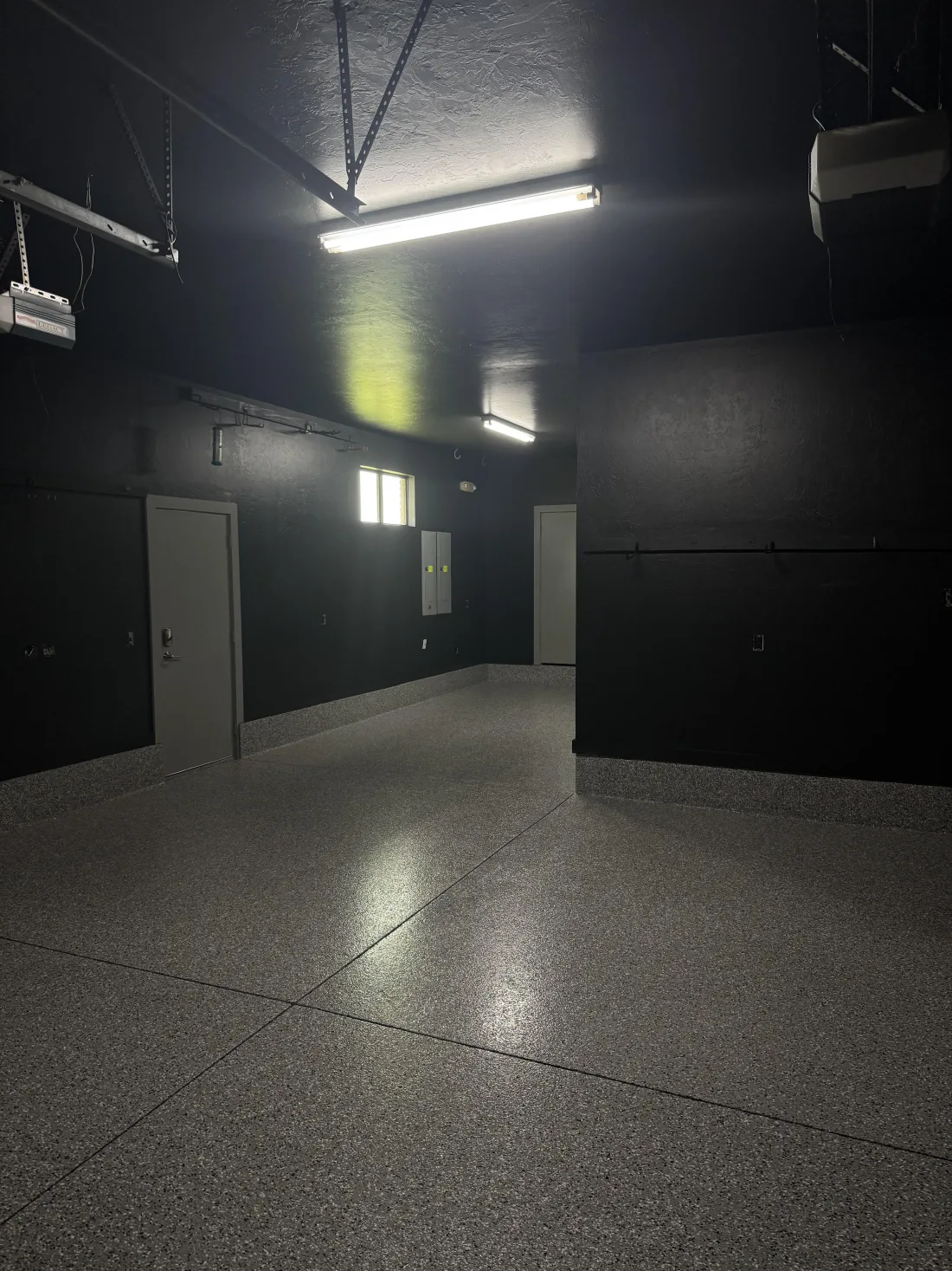 Finished garage floor with a glossy flake coating
