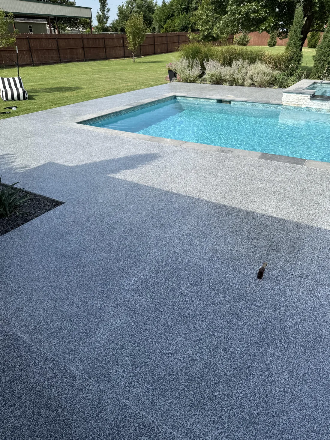 Refinished patio with a clean decorative coating